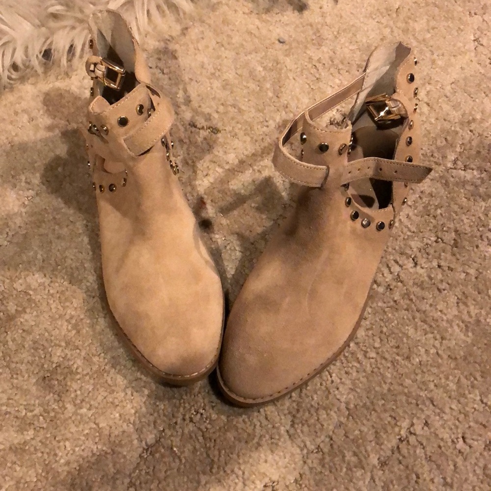 Carlos Santana gold studded ankle boots.